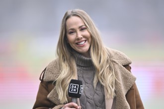 DAZN presenter interviewed microphone micro logo smiling portrait soccer Bundesliga, Voith-Arena,