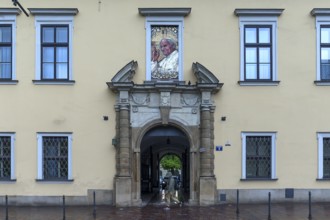 Mosaic portrait of Pope John Paul II above an entrance portal, Krakow, Poland