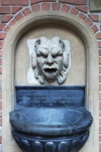 Fountain figure in the courtyard of Collegium Maius, Krakow, Poland