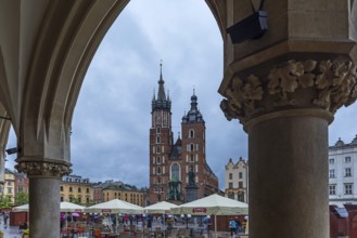 View of St. Mary's Basilica from the arcades of the Cloth Hall, Market Square, Krakow, Poland