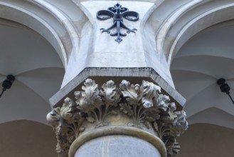 Relief of arcant leaves on the pillars of the arcades of the Cloth Hall, Krakow, Poland