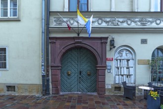 Historic entrance portal with a relief of a bookshelf, Krakow, Poland