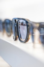 Close-up of blue sunglasses, stylishly arranged, optician, Pforzheim