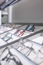 Stylish shelf with a selection of modern, colorful glasses, optician, Pforzheim