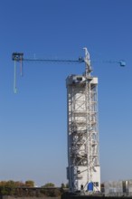 Montreal Bungee Tower with dangling long yellow elastic bungee jumping cord, Old Port of Montreal,