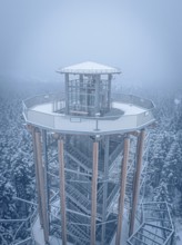 A snow-covered treetop trail with views of the snow-covered landscape, Himmelsglück observation