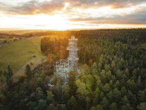 Tower immersed in the warm light of the dawning day, Himmelsglück observation tower with Flying