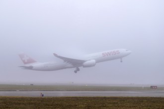 Swiss aircraft, HB-JHG, Airbus A330-300, departure in fog, Zürich Kloten, Switzerland