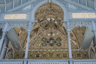 Detail of a richly decorated blue façade with symmetrical patterns, old villa villa of