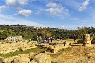 Tourist group, archaeological site in the Valley of the Temples, breathtaking landscape with ruins