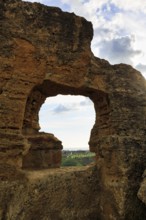 Arkosolium path, necropolis, view through arched niche on coastline and the sea, burial chamber,