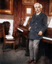 Gabriel Fauré, 1845 – 1924, French composer, next to his piano in his appartement, Boulevard