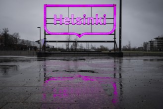 Large pink city logo of Helsinki near Oodi Central Library and Cultural Center, Helsinki, Finland