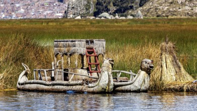 Traditional boat and reed structure in a protected area of the lake, The floating reed islands of
