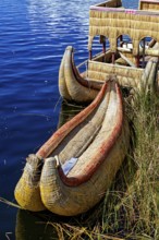 Traditional reed boat on the water in a natural setting, The floating reed islands of the Uros in