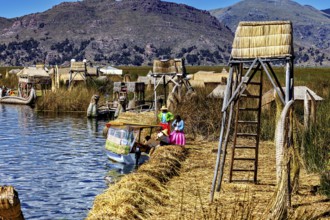 Handmade boats and huts on a lake surrounded by natural scenery, The floating reed islands of the