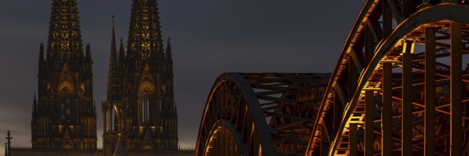 Evening atmosphere, Cologne Cathedral illuminated with LED lamps and the Hohenzollern Bridge,