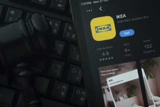 Dhaka, Bangladesh- 28 Oct 2025: An iPad displaying the IKEA app against a judge's gavel and dark