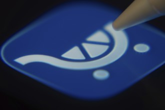 Dhaka, Bangladesh- 06 Dec 2025: Close-up of the Kroger app on a screen with a stylus pointing at it