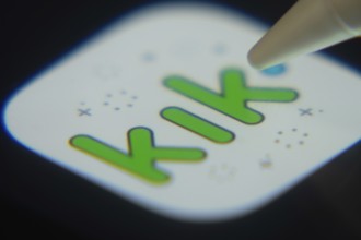 Dhaka, Bangladesh- 06 Dec 2025: Close-up of the Kik app on a screen with a stylus pointing at it