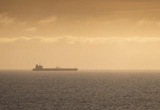 Silhouette, cargo ship, evening light, Baltic Sea