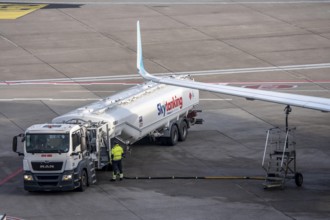 Refueling an aircraft after landing, in front of takeoff, air fuel, kerosene, Skytanking tank truck
