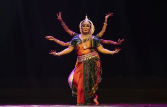 Artists perform Odissi classical dance during a cultural evening program at Shilpgram Mohotsav 2026