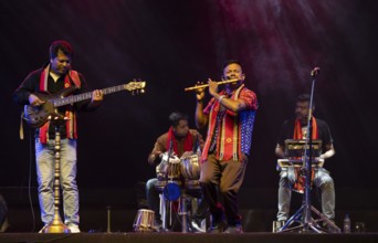 Flutist Dilip Hira performs during a cultural evening program at Shilpgram Mohotsav 2026 in