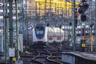 InterCity IC to Zurich leaving Stuttgart Central Station in the morning. Rail signals and overhead