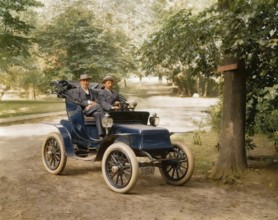Thomas Alva Edison and William Billy Bee in Detroit Electric automobile on Edge Hill Avenue in