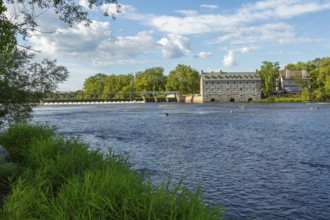 Moulin Neuf water flow control dam and walkway over Des Mille-Iles river plus New Mill on Ile des