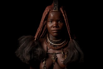 Portrait of an Ovahimba or Himba woman with traditional hairstyle, Kaokoland, Kunene Region,