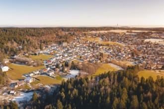 Winter image of a village surrounded by forests and snow-covered fields, Hallwangen, Freudenstadt