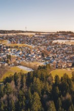 Snow-covered landscape with village and adjacent forest in a wintry atmosphere, Hallwangen,