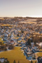 Village in winter with isolated snow-covered houses and fields, surrounded by trees, Hallwangen,