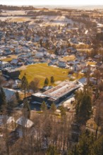 Small town with snow-covered roofs and trees from a bird's eye view, Hallwangen, Freudenstadt