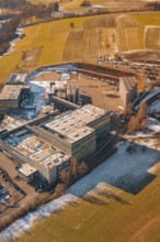 Industrial site in wintry snowy fields and simple countryside, Hallwangen, Freudenstadt district,