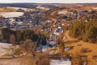 Snowy village nestled in a hilly landscape with forest and fields, Aach, Dornstetten, Freudenstadt