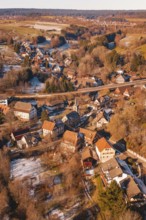 Church in the middle of a snowy village against a forest backdrop, Aach, Dornstetten, Freudenstadt