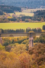 Autumn landscape with a bridge over wooded hills and fields, Dornstetten, Freudenstadt district,