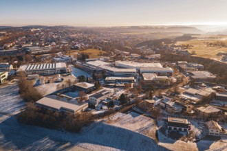 City view in winter with various buildings and gentle sunrise, Dornstetten, Freudenstadt district,