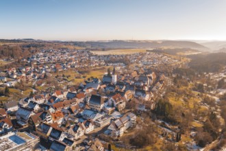 Picturesque winter town with historic buildings and surrounding hills, Dornstetten, Freudenstadt