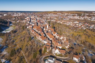 Aerial view of city in winter surroundings with characteristic red roofs, Dornstetten, Freudenstadt