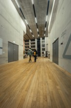 Bright modern interior with wooden floor and multiple doors, Tate Modern of Art, Lodon, United