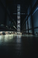 High room with luminous installation, dark industrial atmosphere, Tate Modern of Art, Lodon, United