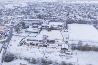 Village with snow-covered roofs, modern and historic buildings, Empfingen, Freudenstadt district,