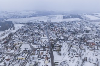 View of a snowy town and surrounding fields surrounded by grey sky, Empfingen, Freudenstadt