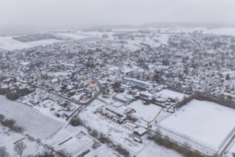 Snowy village with wide fields, houses and roads from a bird's eye view, Empfingen, Freudenstadt