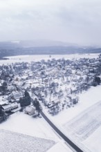 Snowy village surrounded by fields and trees in a wintry landscape, Wiesenstetten, Freudenstadt