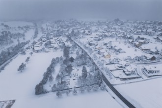 View of a winter landscape with snowy fields and a road, Schopfloch, Freudenstadt district, Germany